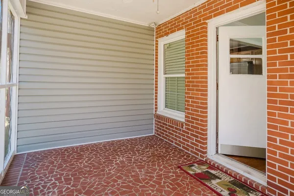 a view of a door and a window