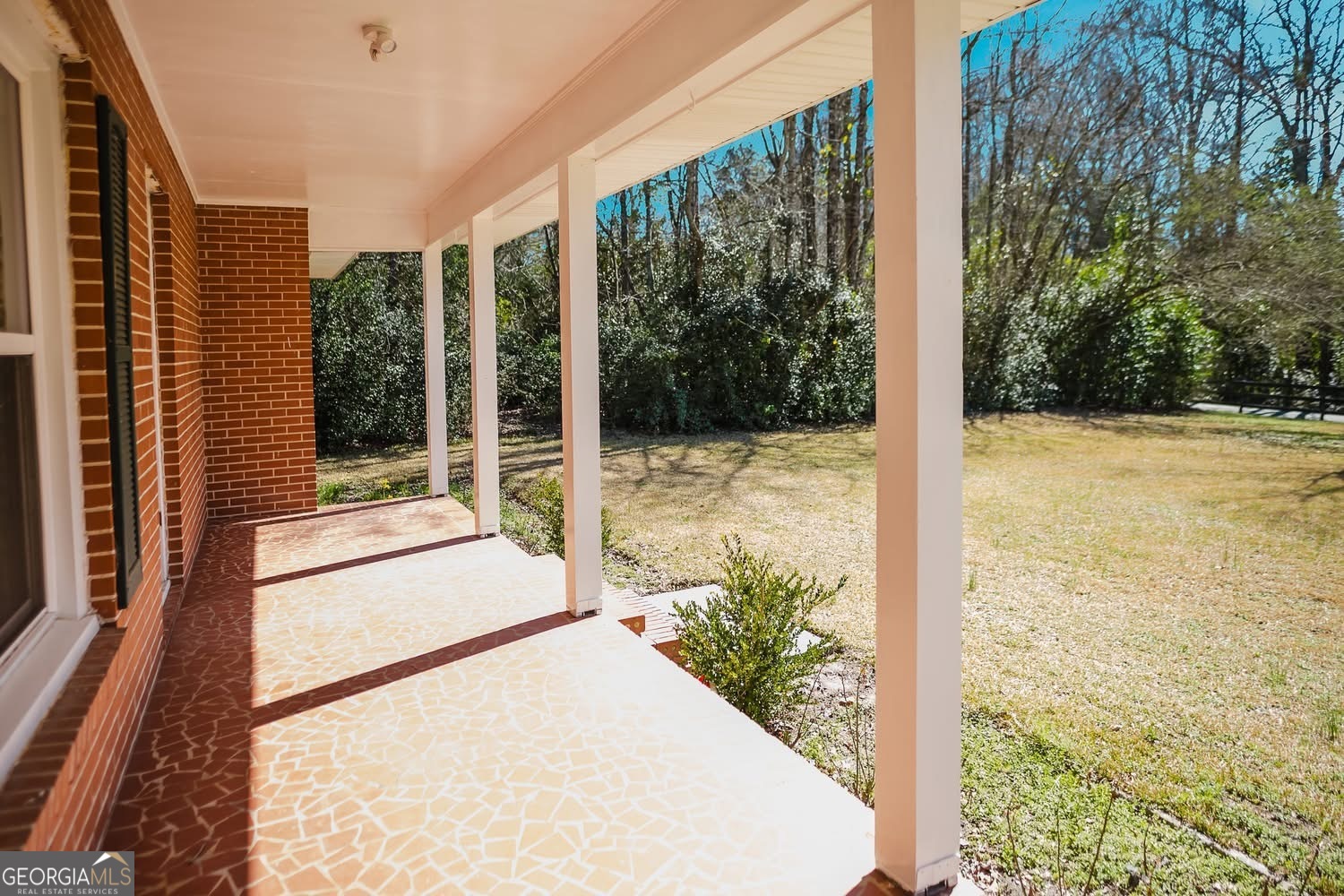 348 School Road Hampton, GA 30228 - Photo 34 of 46 a view of a balcony with a floor to ceiling window and floor to ceiling window and wooden fence