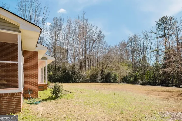a view of a yard with trees