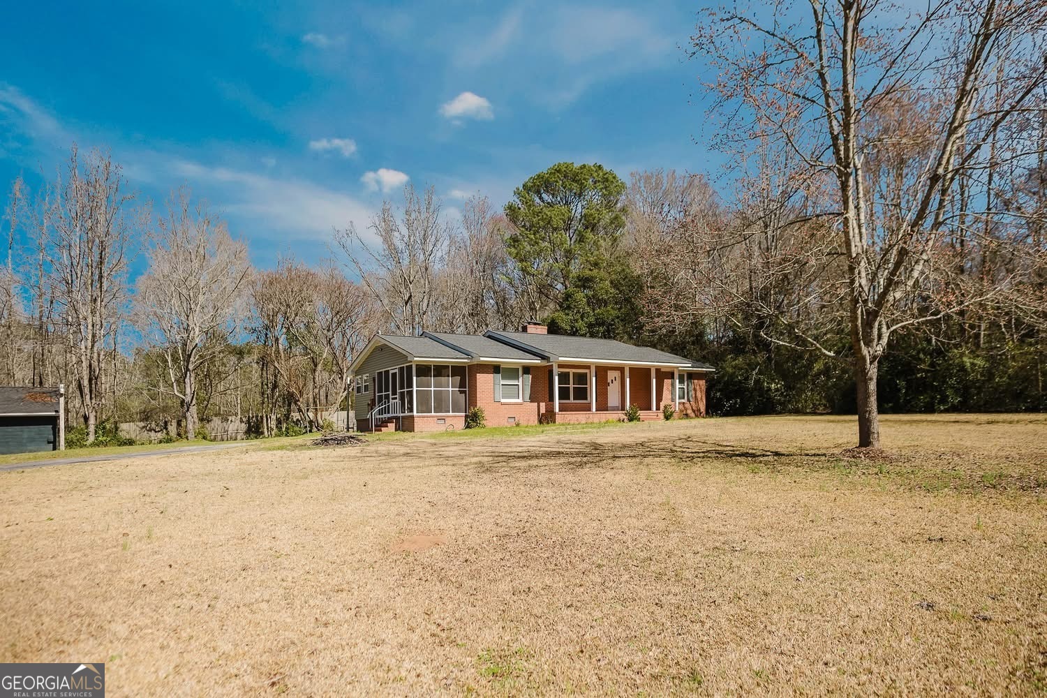 348 School Road Hampton, GA 30228 - Photo 44 of 46 a front view of a house with a yard covered in snow