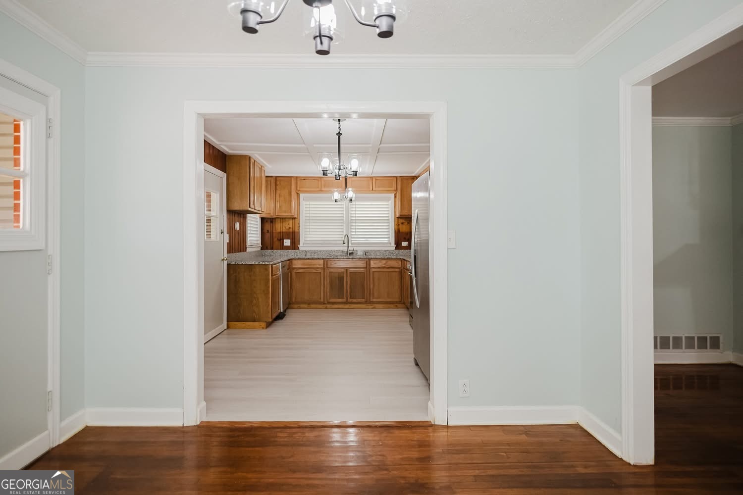 348 School Road Hampton, GA 30228 - Photo 10 of 46 a view of a kitchen with wooden cabinet and a refrigerator