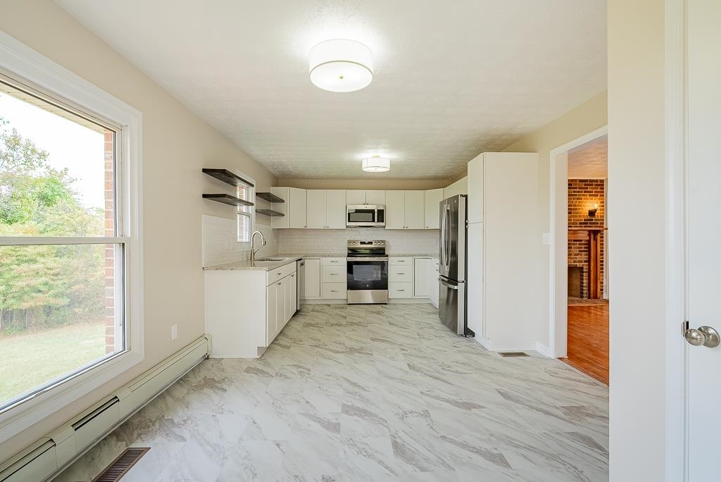 212 Esther's Lookout Shenandoah, VA 22849 - Photo 13 of 68 a view of a kitchen with a sink and refrigerator
