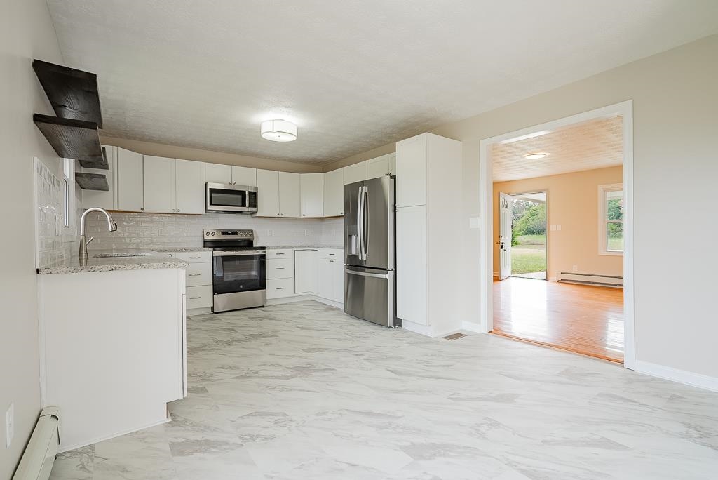 212 Esther's Lookout Shenandoah, VA 22849 - Photo 14 of 68 a kitchen with stainless steel appliances a refrigerator stove microwave and sink
