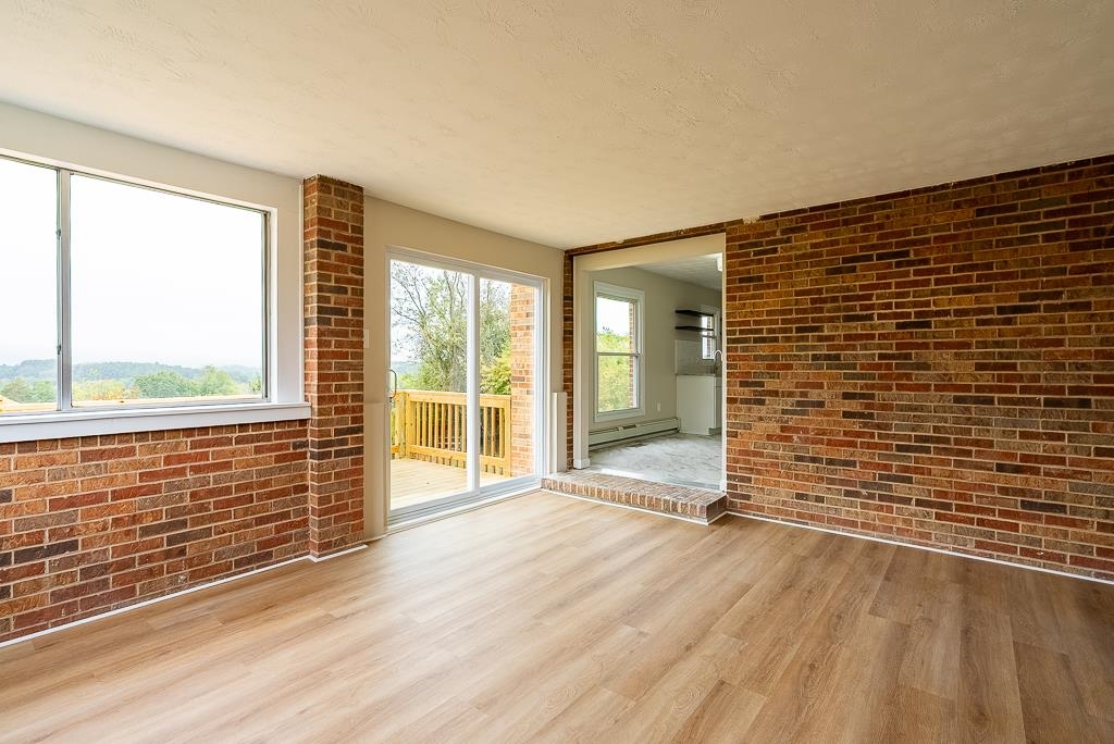 212 Esther's Lookout Shenandoah, VA 22849 - Photo 21 of 68 a view of an empty room with wooden floor and a window