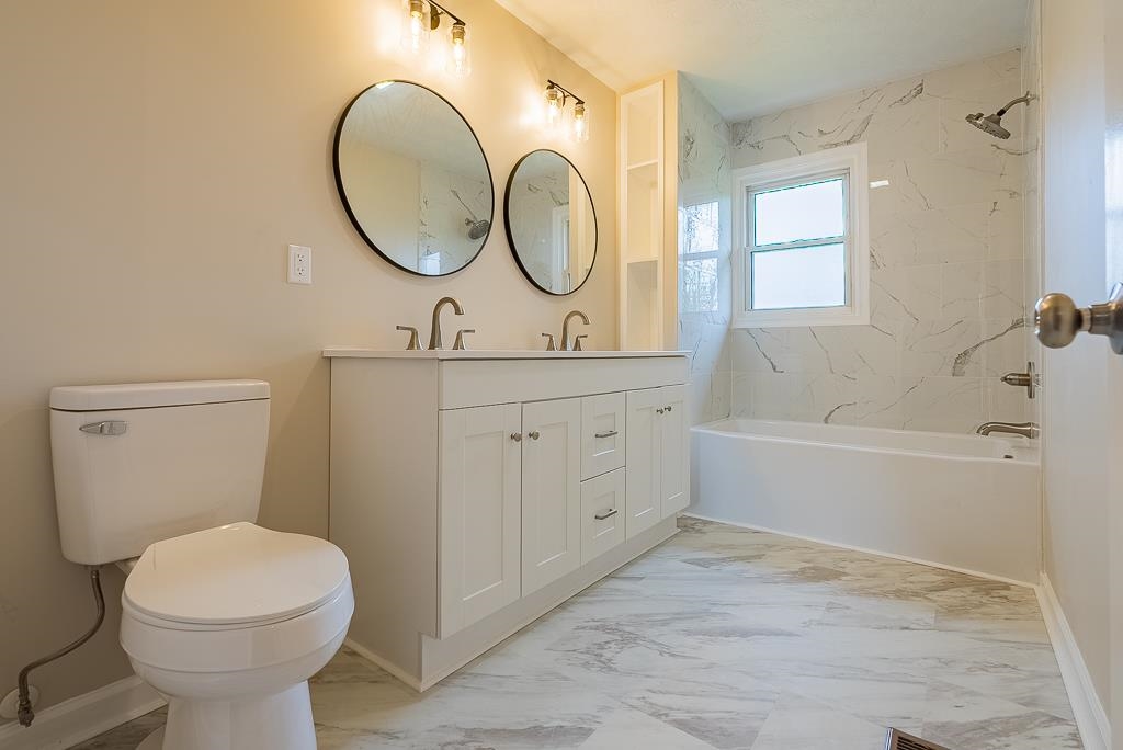 212 Esther's Lookout Shenandoah, VA 22849 - Photo 37 of 68 a bathroom with a sink a toilet and a mirror