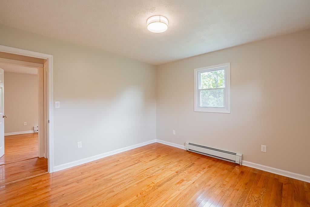 212 Esther's Lookout Shenandoah, VA 22849 - Photo 38 of 68 an empty room with wooden floor and windows