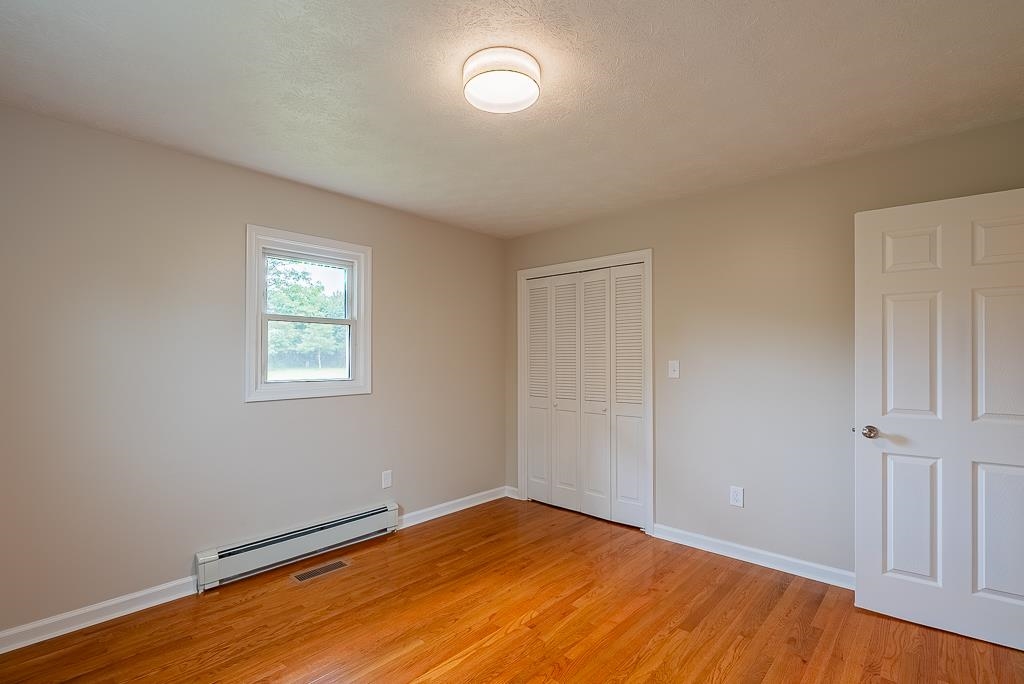 212 Esther's Lookout Shenandoah, VA 22849 - Photo 40 of 68 an empty room with wooden floor and windows