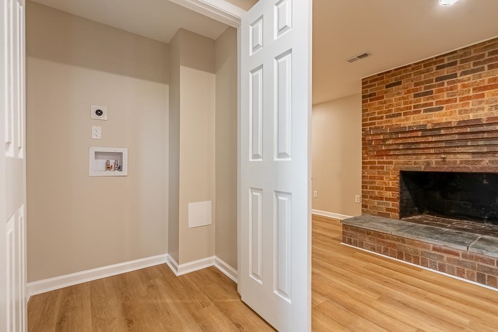 212 Esther's Lookout Shenandoah, VA 22849 - Photo 46 of 68 a view of an empty room with wooden floor and a fireplace