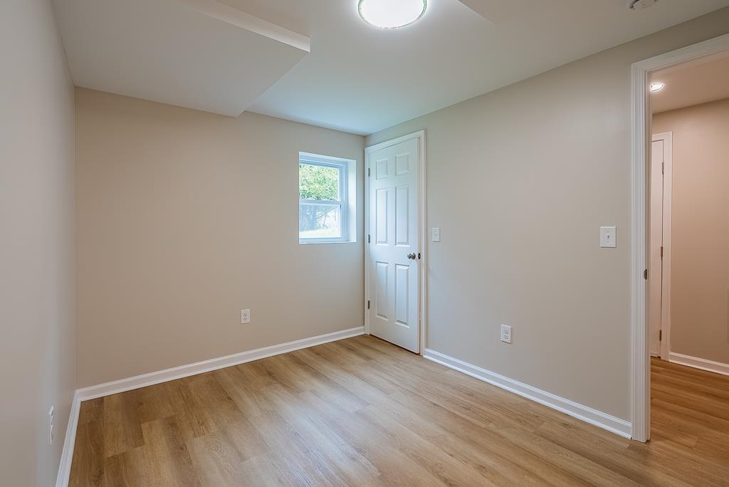 212 Esther's Lookout Shenandoah, VA 22849 - Photo 50 of 68 an empty room with wooden floor and windows