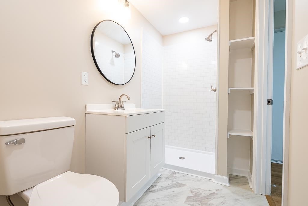 212 Esther's Lookout Shenandoah, VA 22849 - Photo 52 of 68 a bathroom with a toilet sink and a mirror