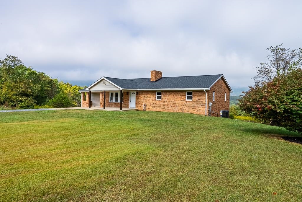 212 Esther's Lookout Shenandoah, VA 22849 - Photo 66 of 68 a front view of a house with a yard