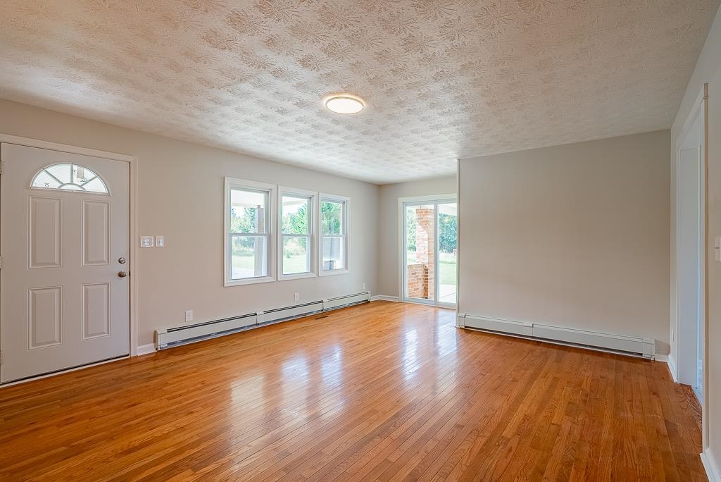 212 Esther's Lookout Shenandoah, VA 22849 - Photo 7 of 68 an empty room with wooden floor and windows