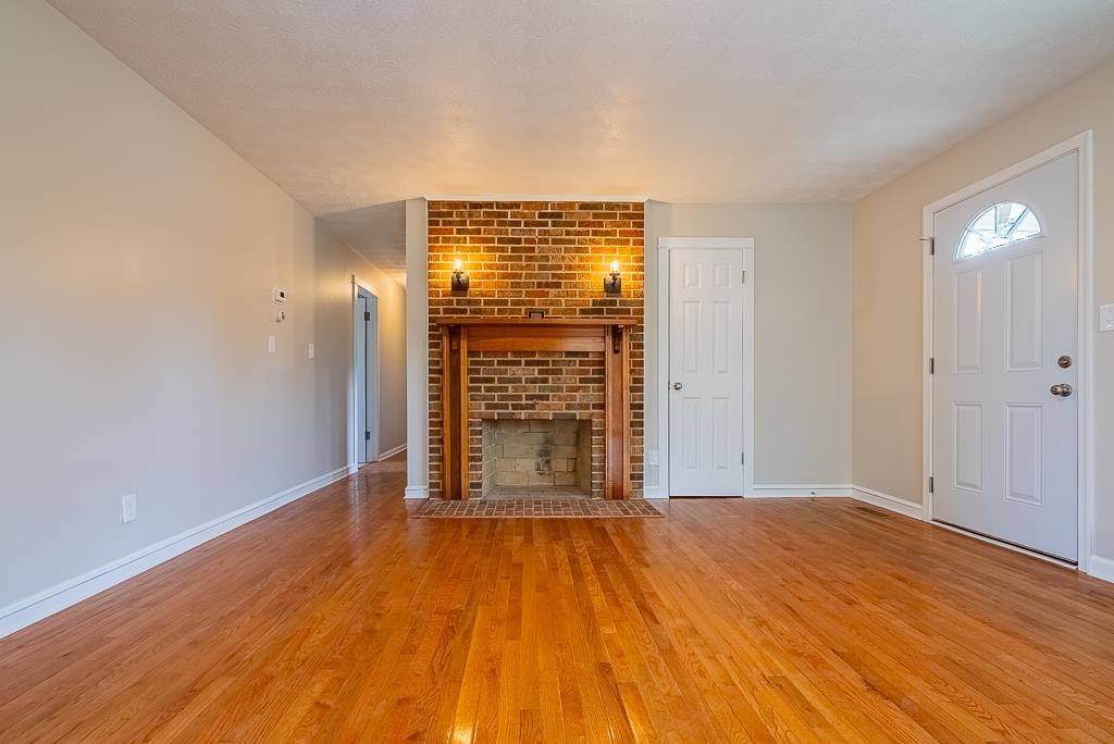 212 Esther's Lookout Shenandoah, VA 22849 - Photo 8 of 68 a view of an empty room with wooden floor and a window