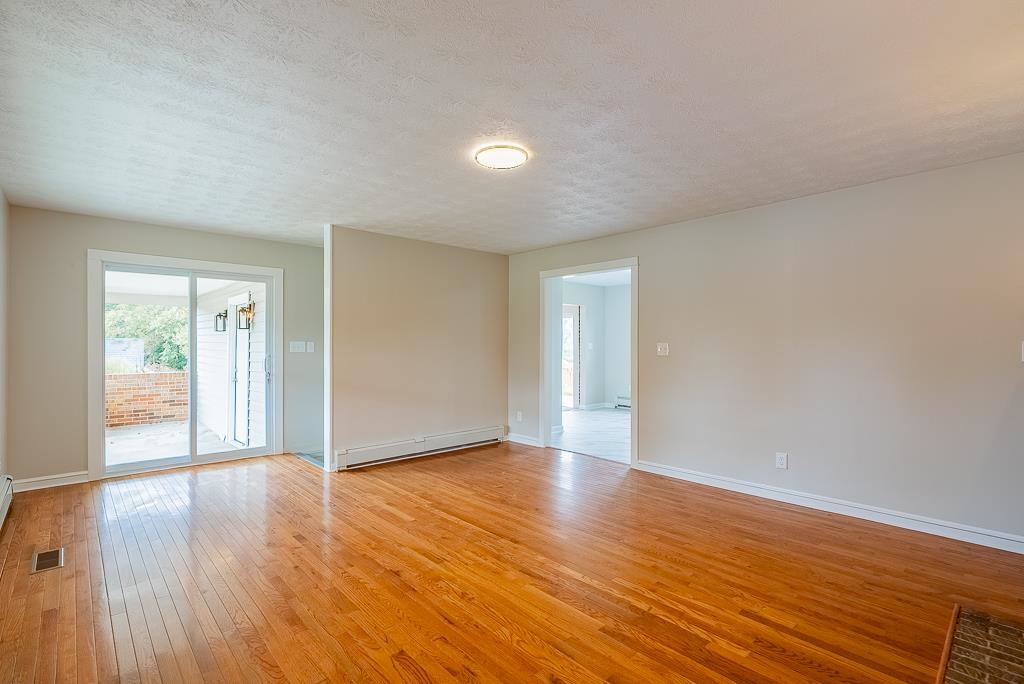 212 Esther's Lookout Shenandoah, VA 22849 - Photo 9 of 68 a view of an empty room with wooden floor and a window