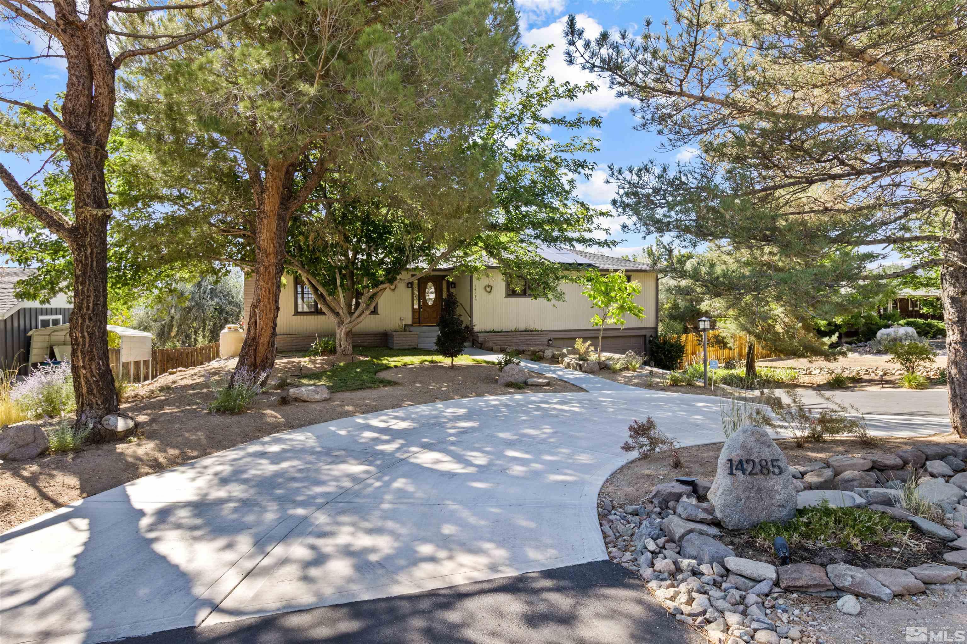 14285 Virginia Foothills Drive Reno, NV 89521 - Photo 15 of 39 a view of a backyard with large trees