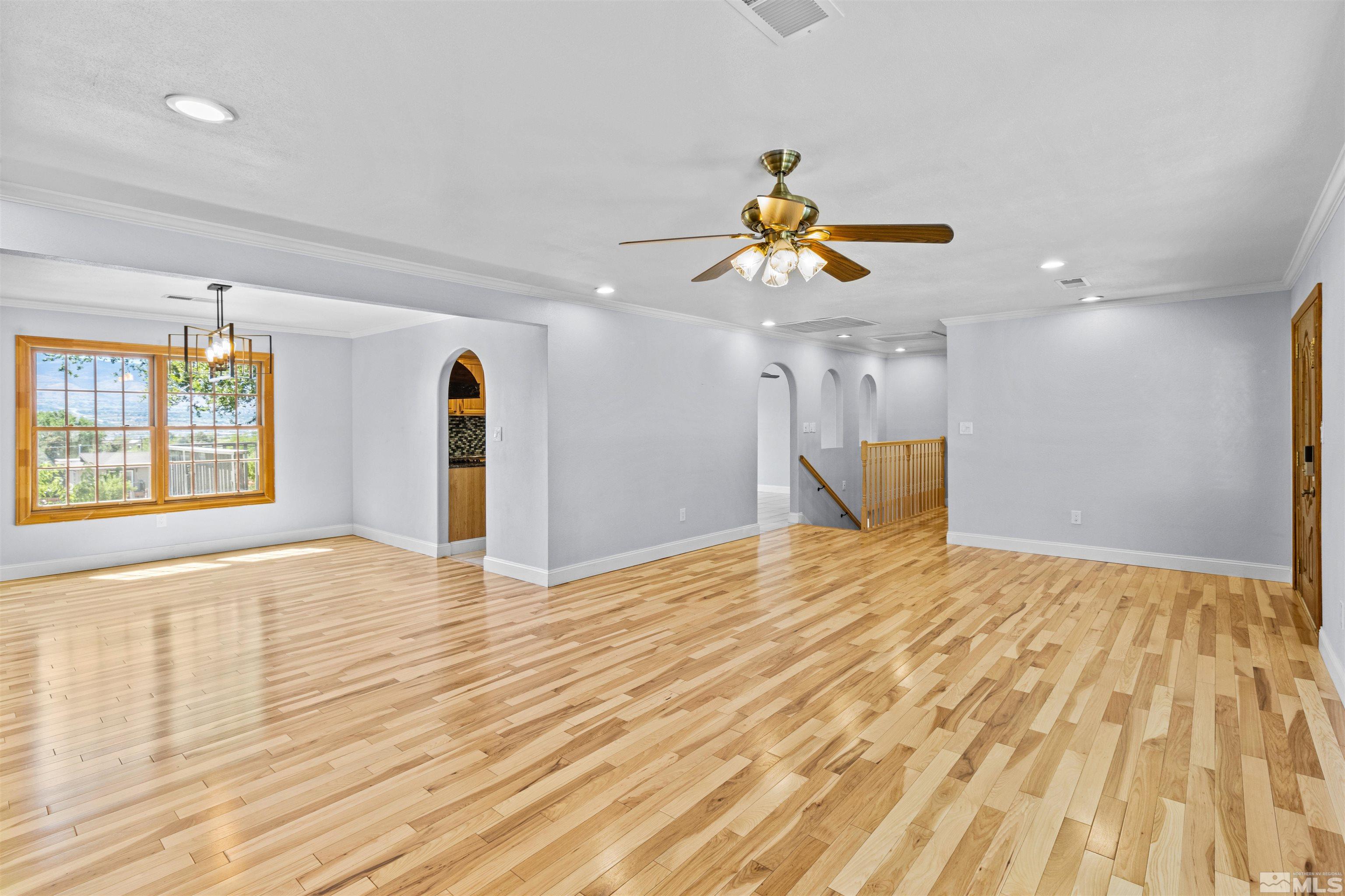 14285 Virginia Foothills Drive Reno, NV 89521 - Photo 22 of 39 a view of empty room with wooden floor and fan