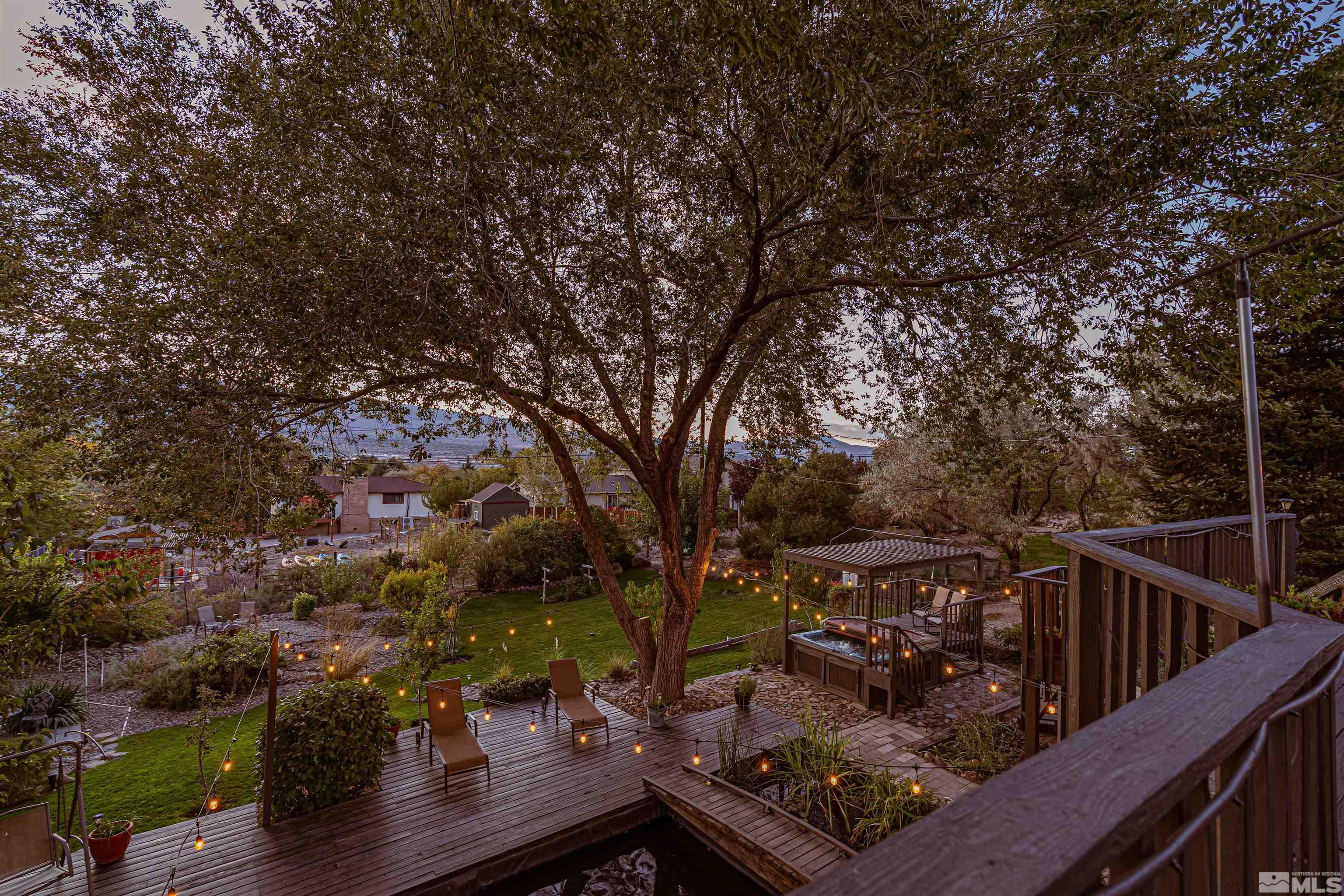14285 Virginia Foothills Drive Reno, NV 89521 - Photo 27 of 39 a view of a balcony with wooden floor and fence