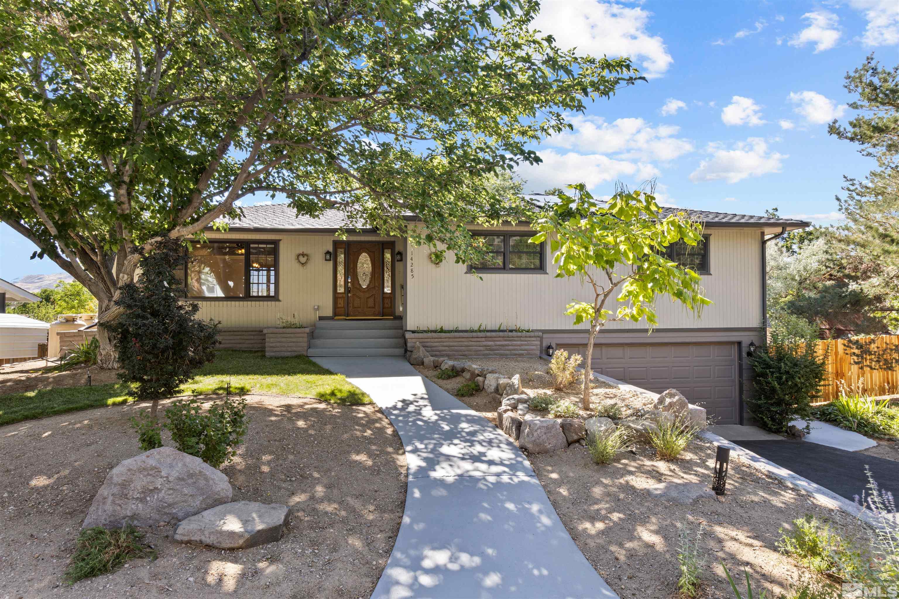 14285 Virginia Foothills Drive Reno, NV 89521 - Photo 28 of 39 a front view of a house with a yard