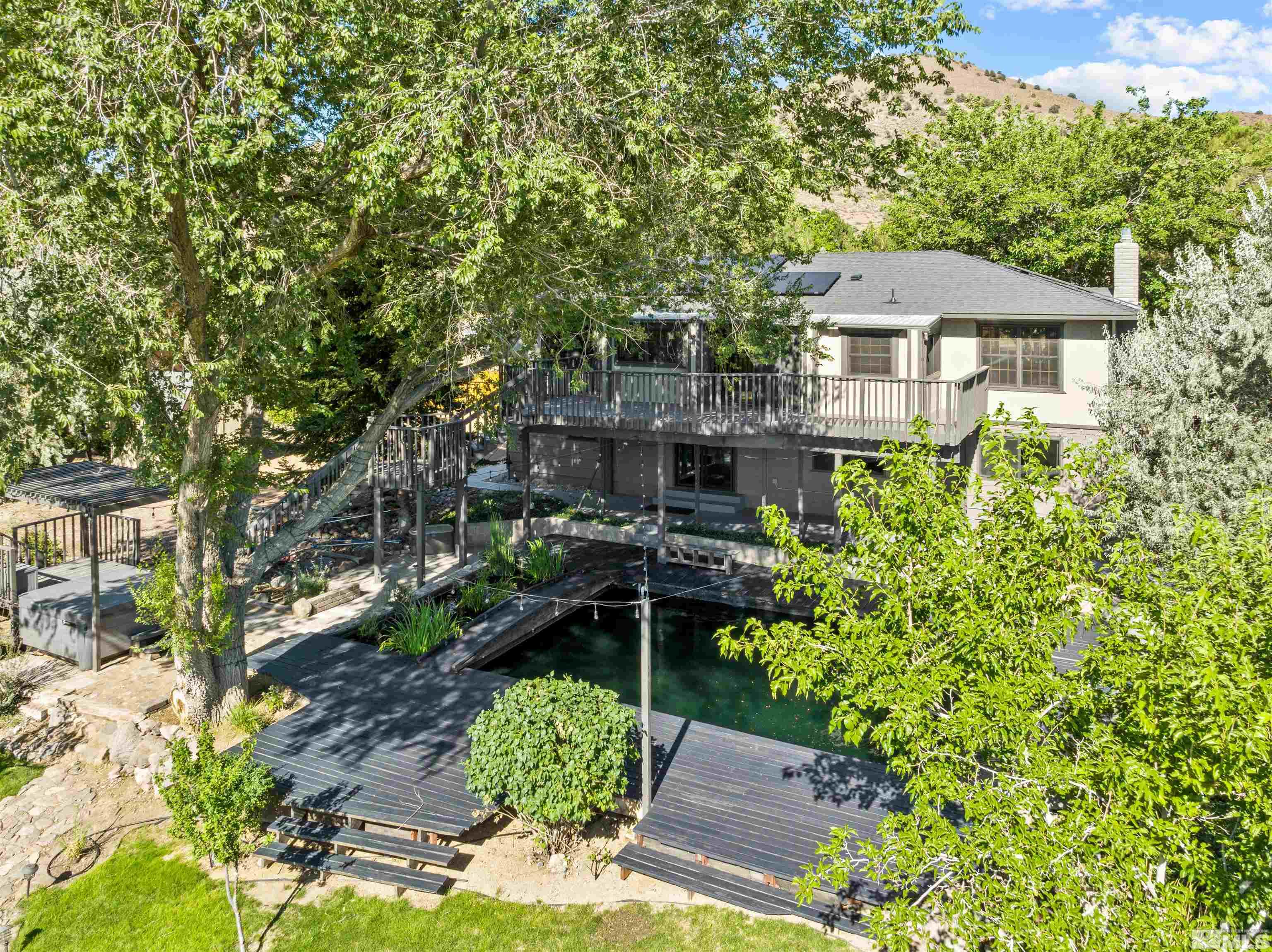 14285 Virginia Foothills Drive Reno, NV 89521 - Photo 31 of 39 a front view of a house with a garden