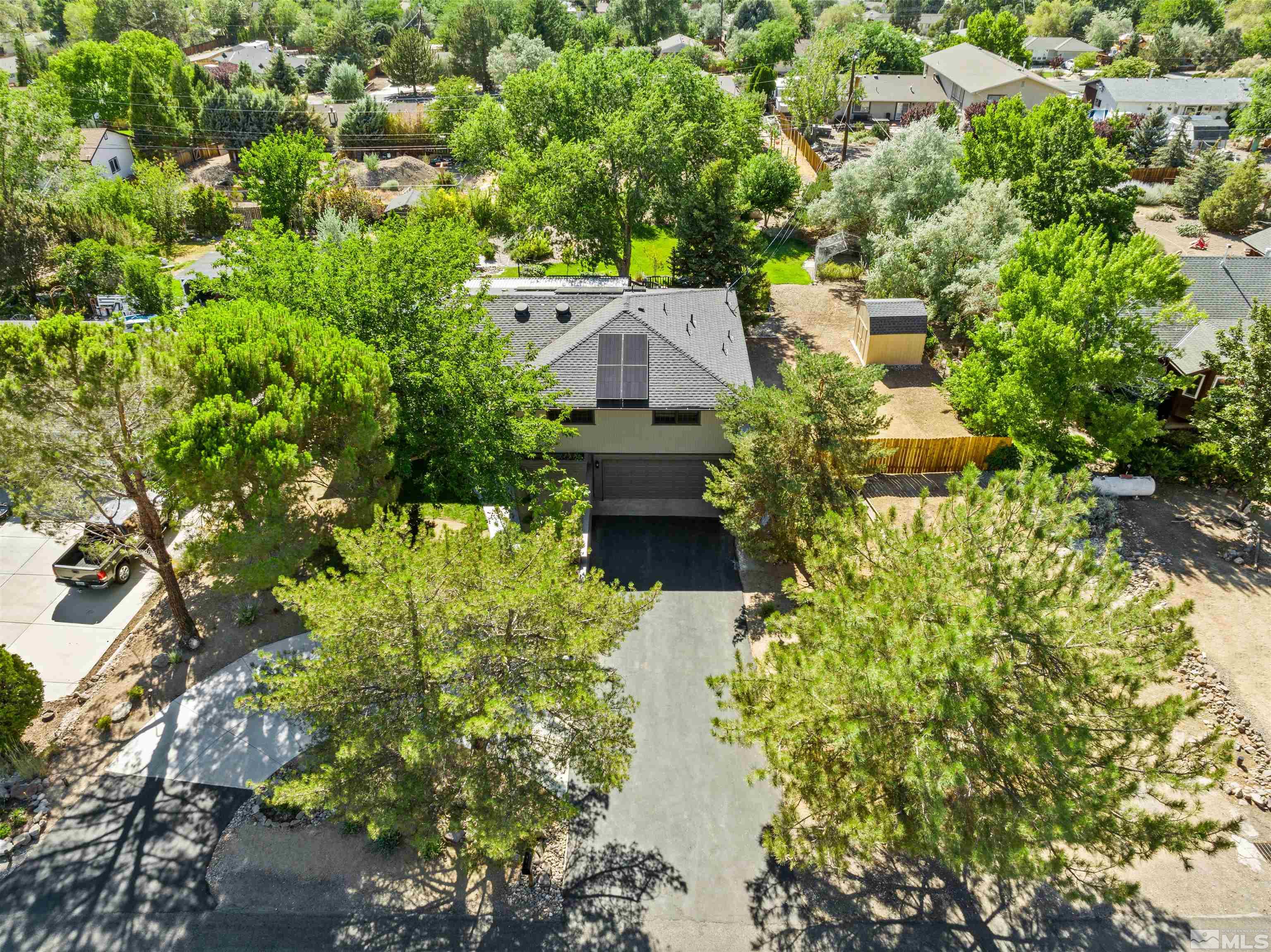 14285 Virginia Foothills Drive Reno, NV 89521 - Photo 33 of 39 a aerial view of a house with a yard and large trees