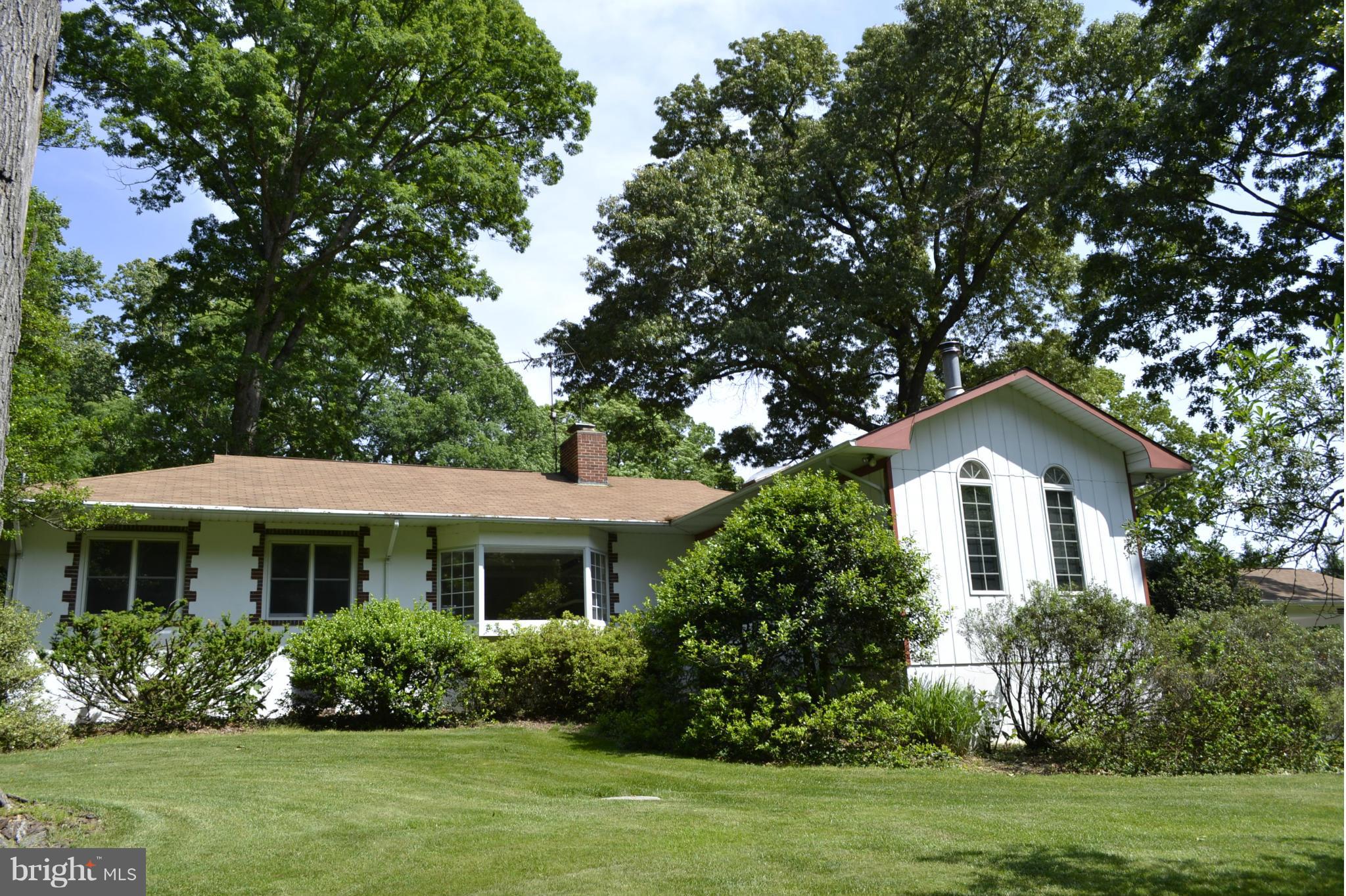 13407 Roxbury Road Silver Spring, MD 20904 - Photo 1 of 23 a front view of a house with a yard and trees