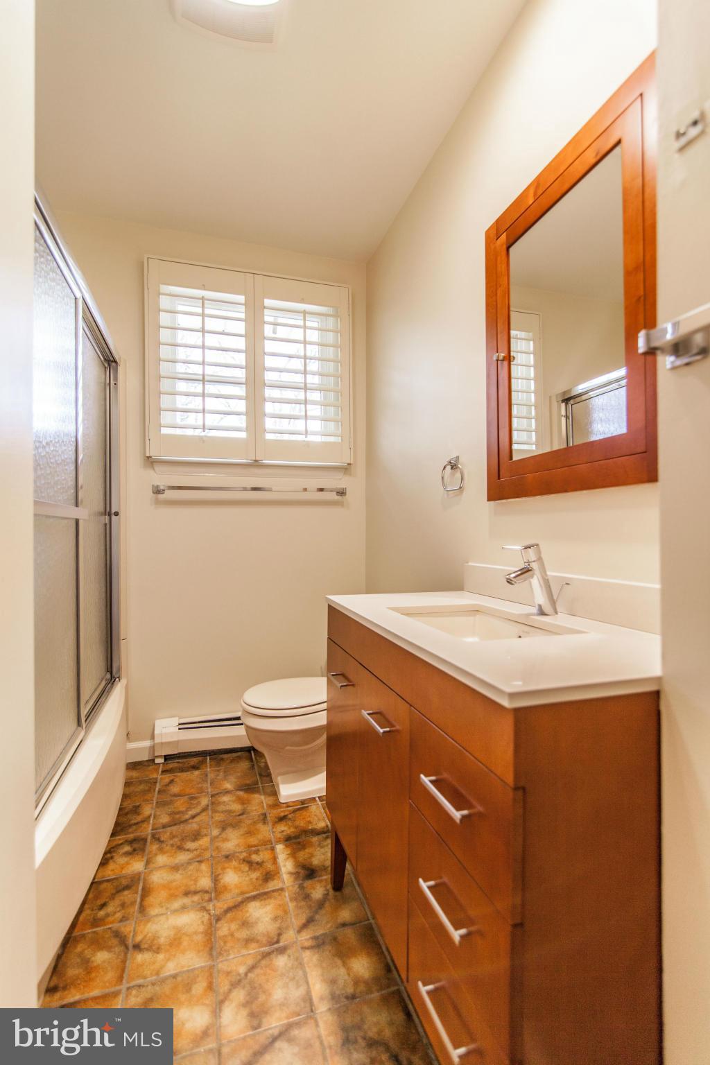13407 Roxbury Road Silver Spring, MD 20904 - Photo 14 of 23 a bathroom with a sink and a mirror