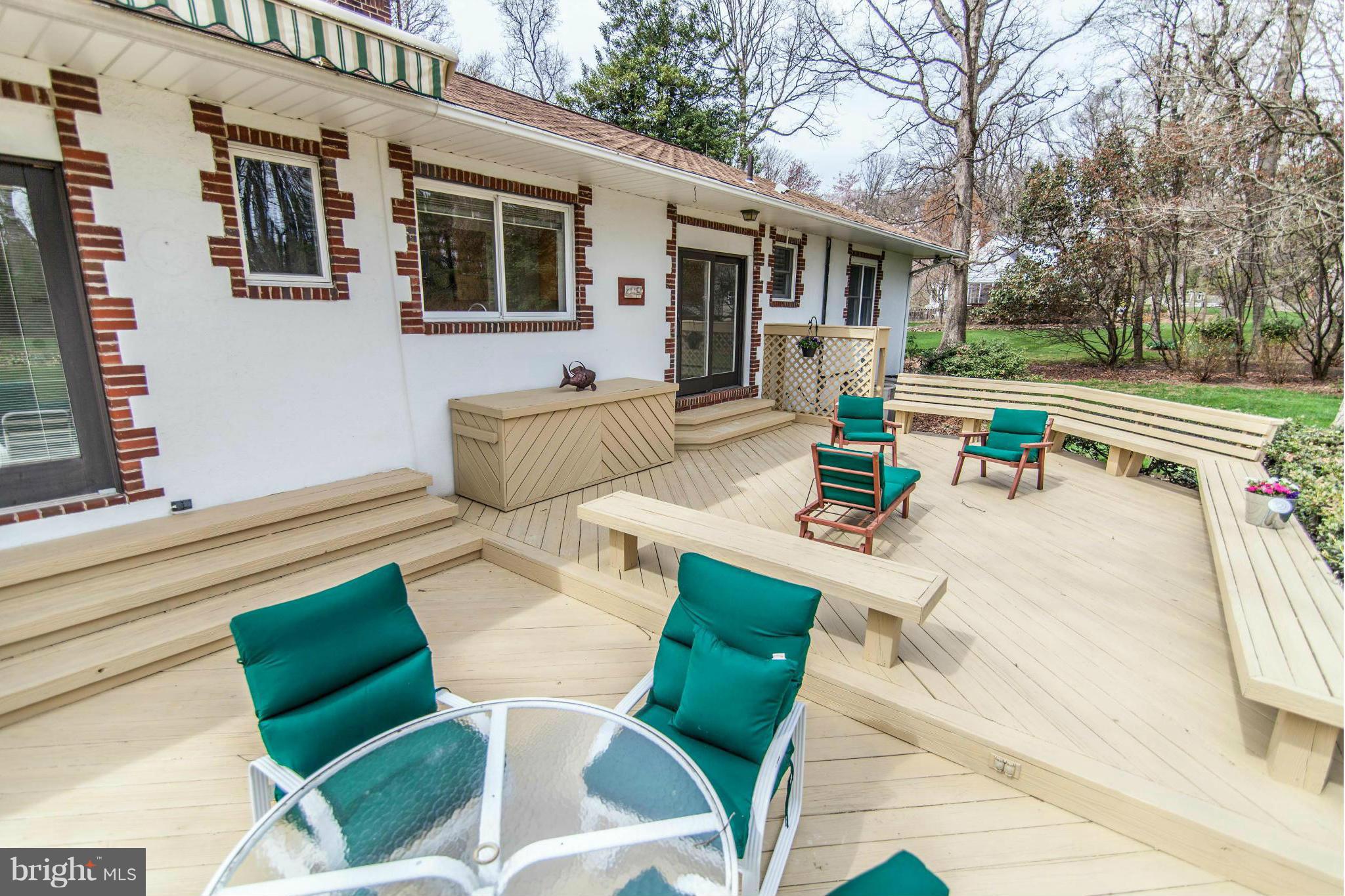 13407 Roxbury Road Silver Spring, MD 20904 - Photo 21 of 23 a view of a patio with couches table and chairs and potted plants