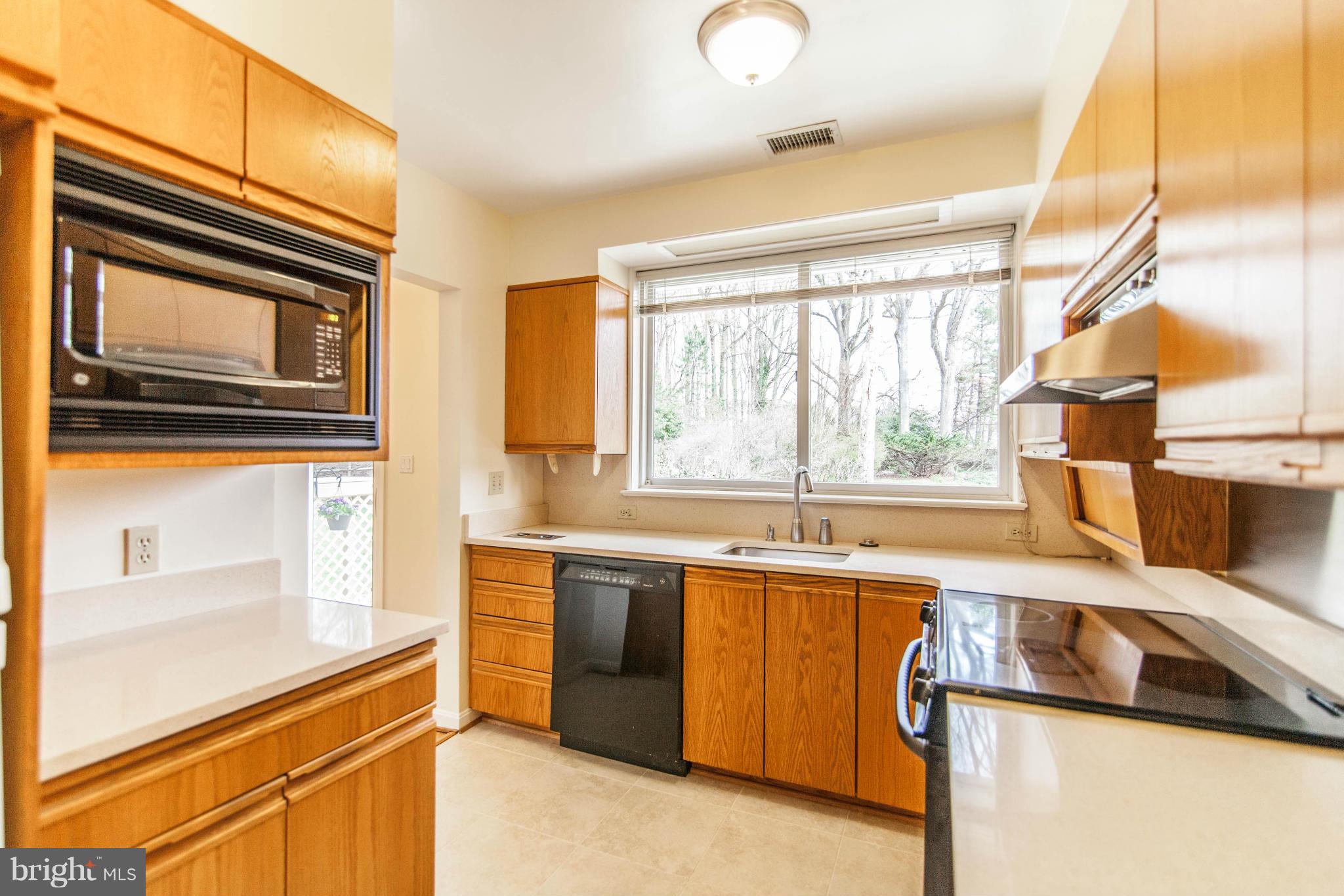 13407 Roxbury Road Silver Spring, MD 20904 - Photo 8 of 23 a kitchen that has a sink and a stove