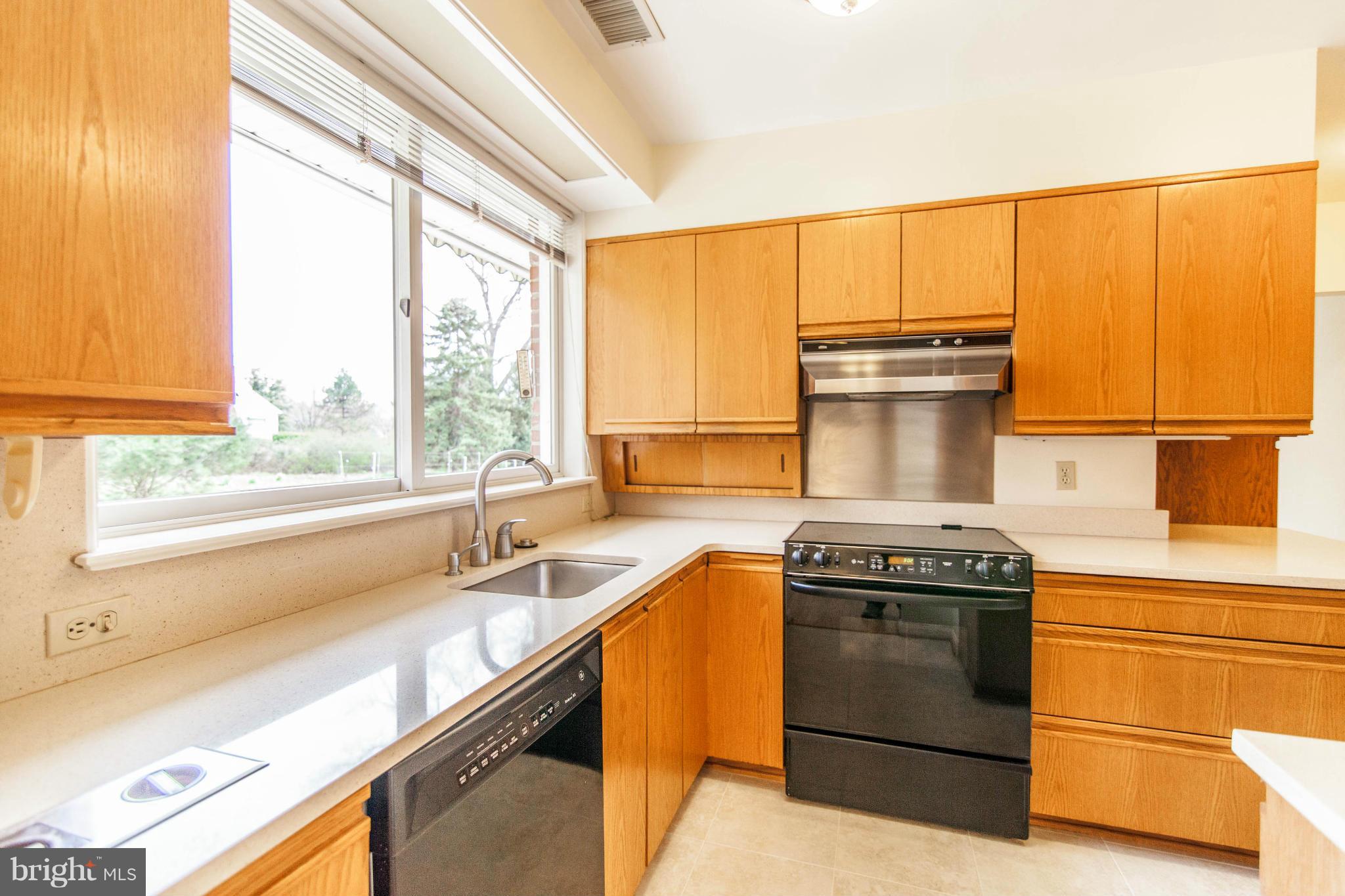 13407 Roxbury Road Silver Spring, MD 20904 - Photo 9 of 23 a kitchen with a stove and a sink
