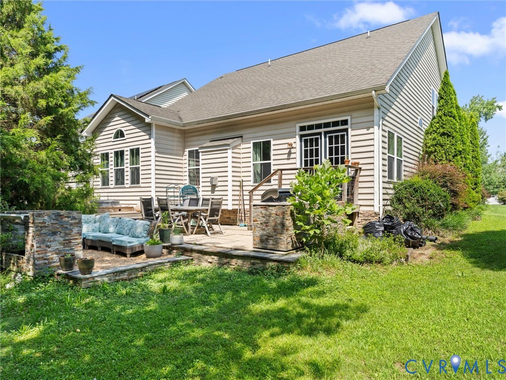 7434 South Franklins Way Quinton, VA 23141 - Photo 29 of 31 Rear exterior featuring tan siding, a gabled roofl