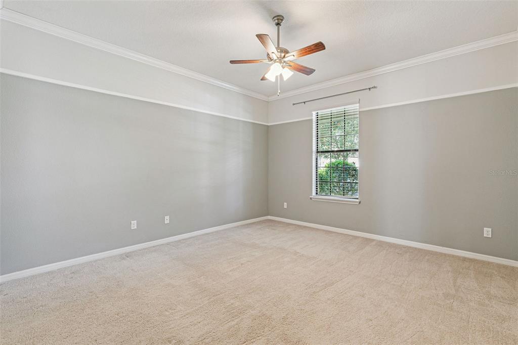 7137 Beek Street Windermere, FL 34786 - Photo 17 of 33 an empty room with windows and fan