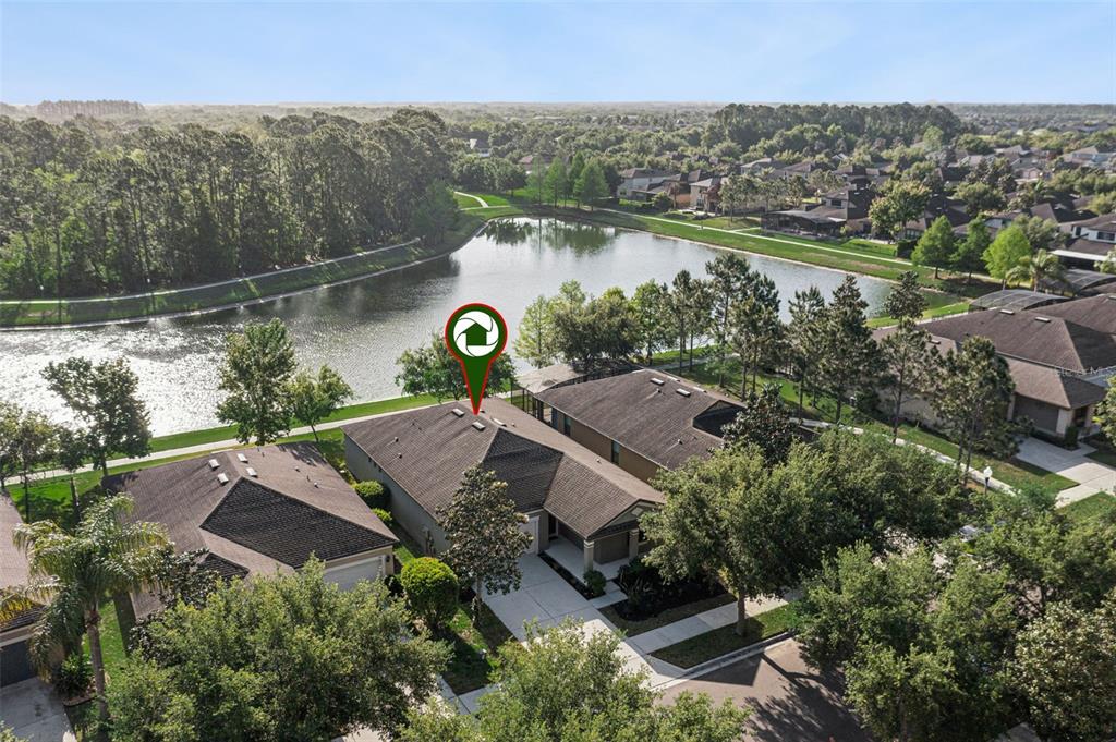 7137 Beek Street Windermere, FL 34786 - Photo 2 of 33 an aerial view of a house with outdoor space and lake view