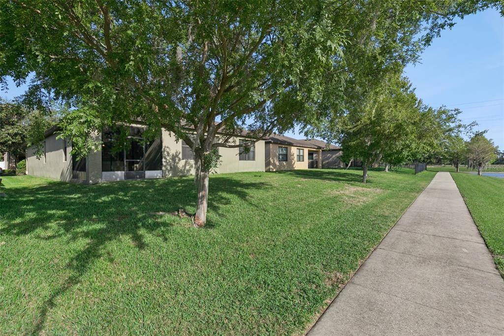 7137 Beek Street Windermere, FL 34786 - Photo 29 of 33 a house view with a garden space