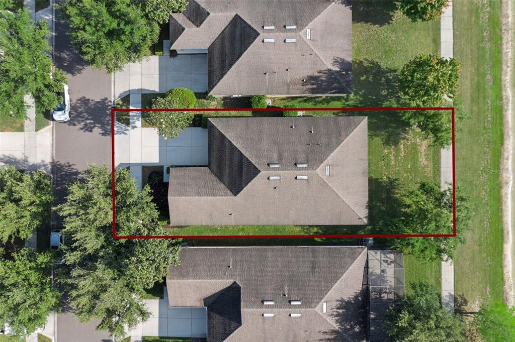 7137 Beek Street Windermere, FL 34786 - Photo 30 of 33 an aerial view of a house with a yard