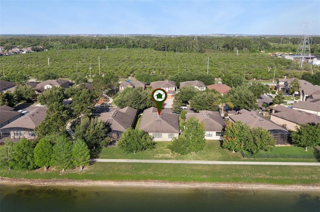 7137 Beek Street Windermere, FL 34786 - Photo 31 of 33 an aerial view of a golf course with parking space