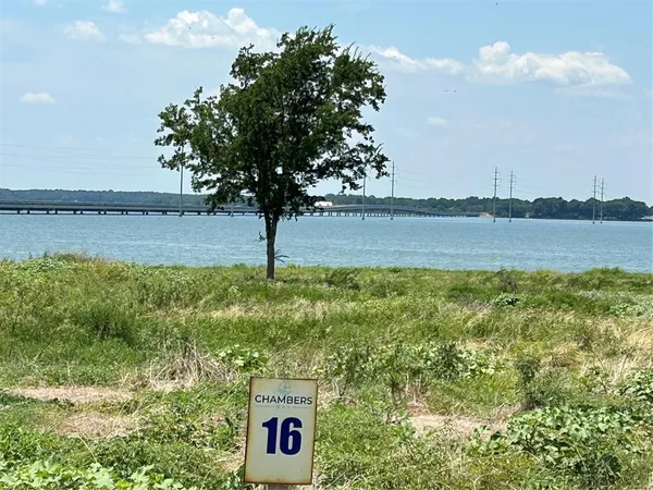 a view of a lake with a yard