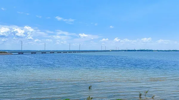 a view of a lake and a yard