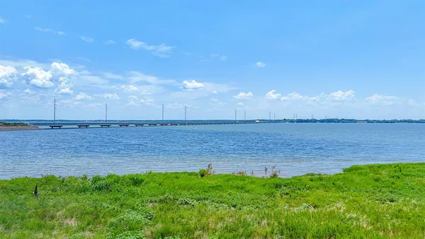 a view of a swimming pool with a yard