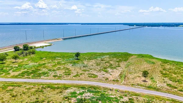 a view of a large yard with an ocean