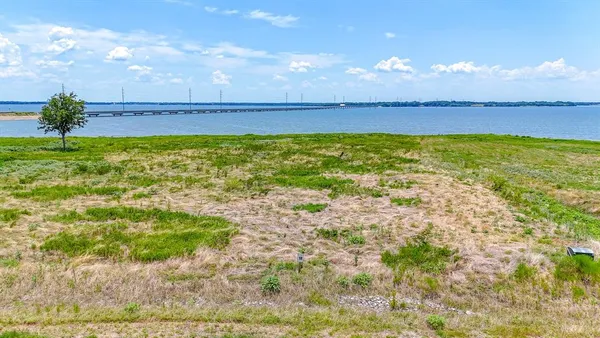 a view of a swimming pool with a yard
