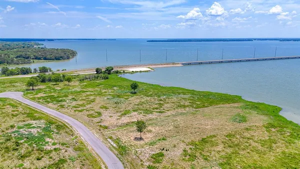a view of a lake with a big yard