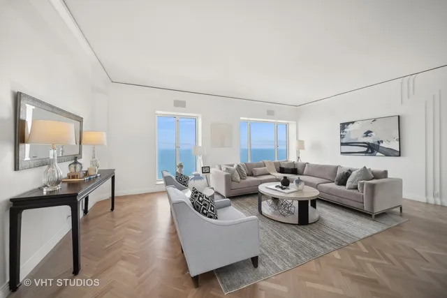 a living room with furniture and a table