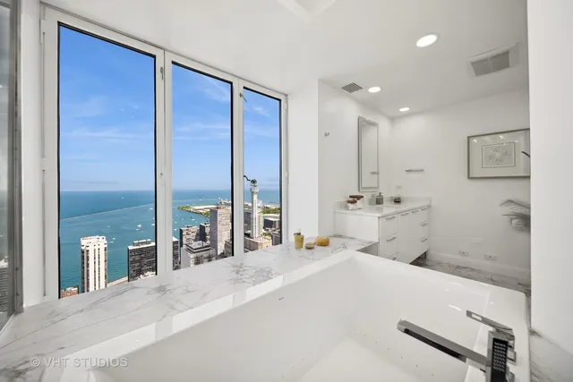 a large bedroom with a large bed and furniture