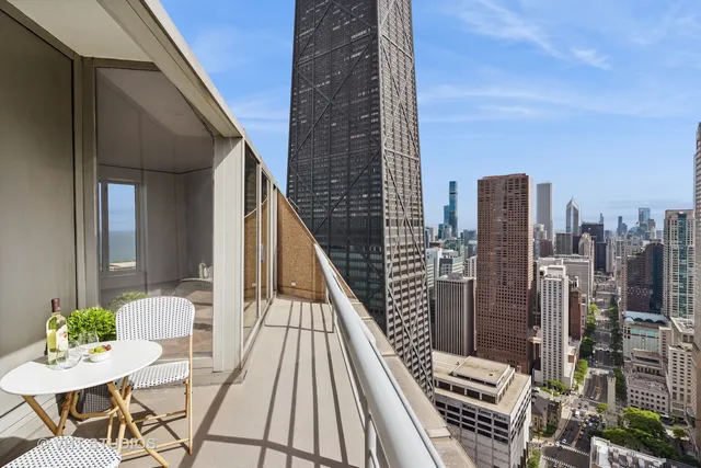 a view of balcony with furniture