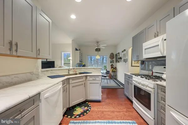 a kitchen with a stove and a sink