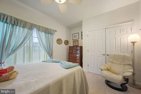 a bathroom with a granite countertop sink toilet a mirror a vanity and shower
