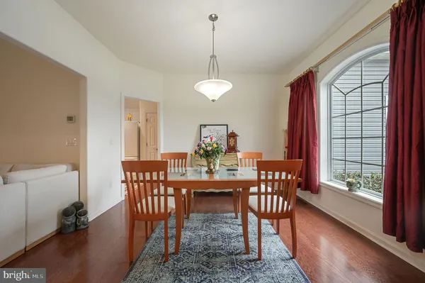 a view of a livingroom with workspace and a window