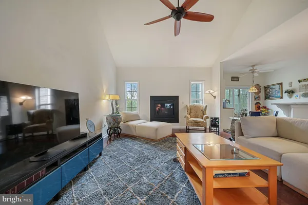 a bedroom with furniture and a fireplace
