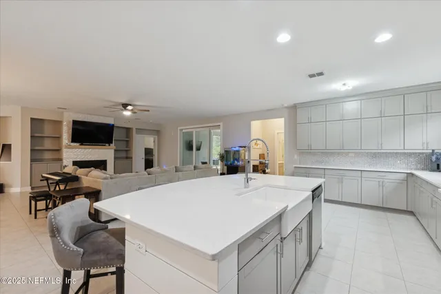 a kitchen with a stove a sink and a refrigerator