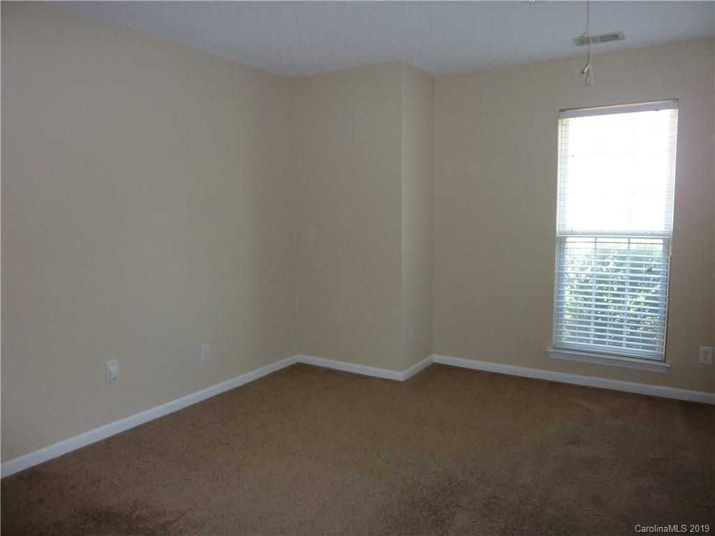 3607 Marbury Road Charlotte, NC 28269 - Photo 13 of 16 an empty room with a window